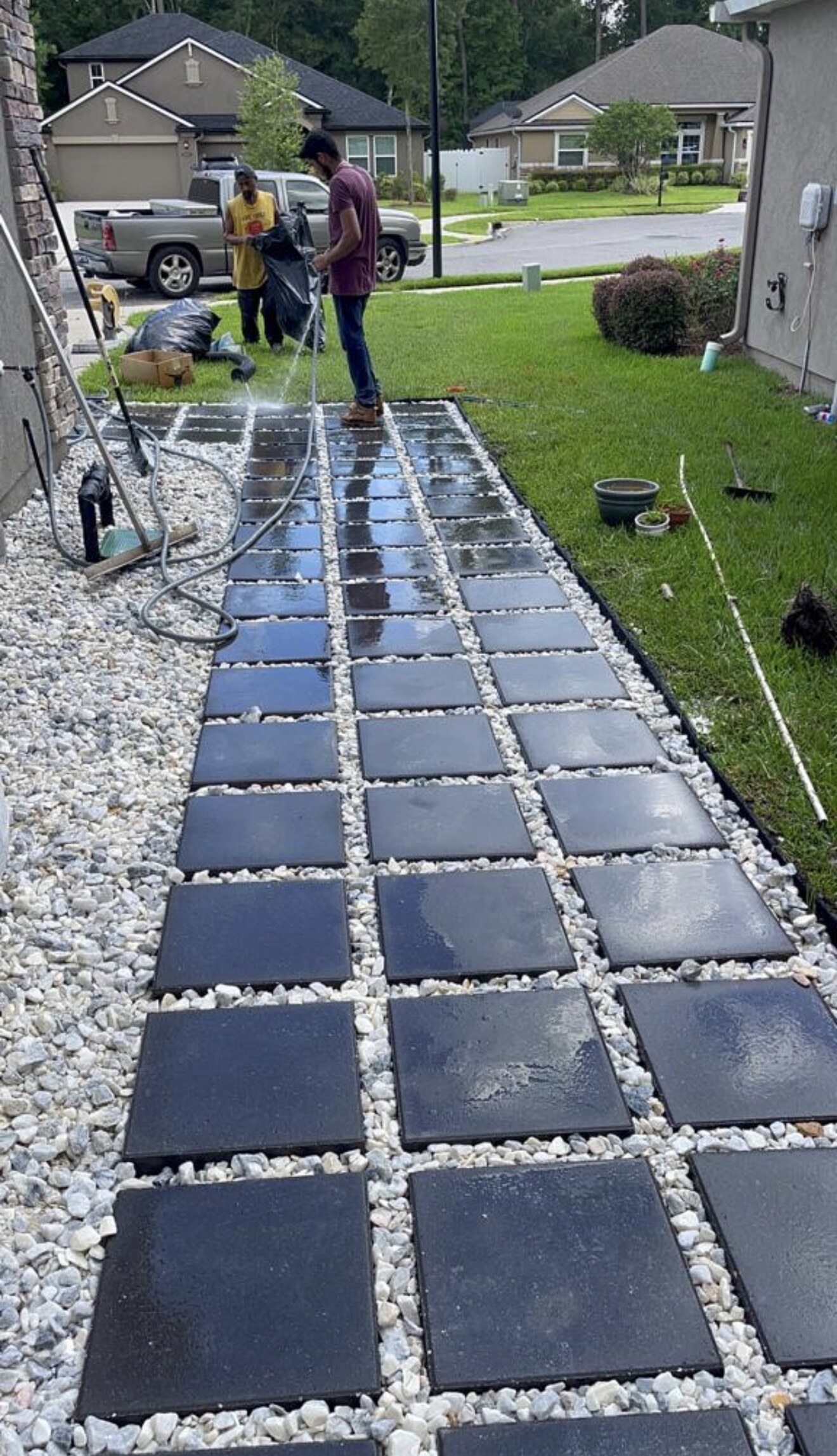 View along the in-progress paver path and gravel work at the Mandarin outdoor-living project.