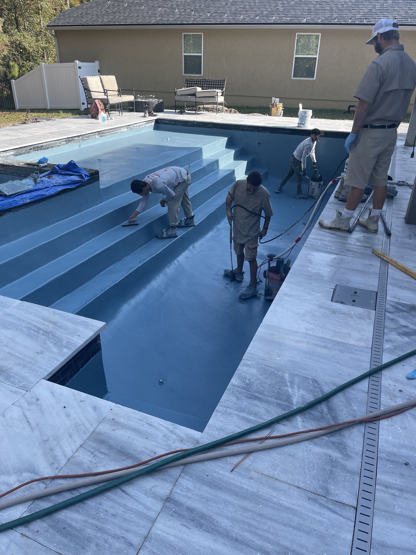 Closer construction view of the pool and the work area beside the deck.